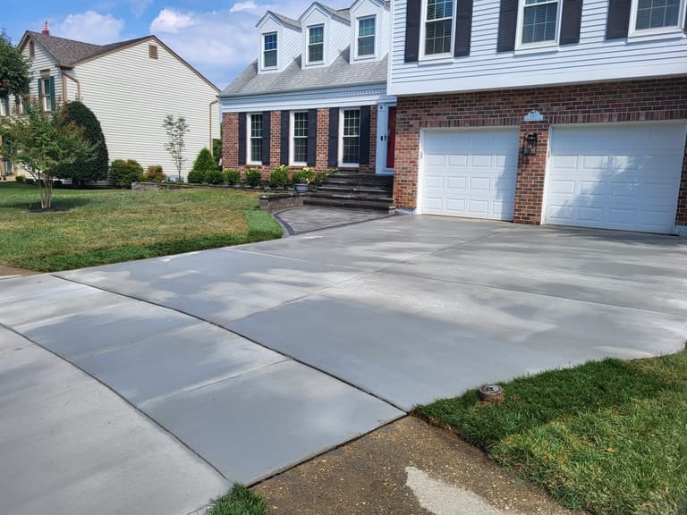 Rebuilt driveway sweeping up to a two-car garage in Annapolis
